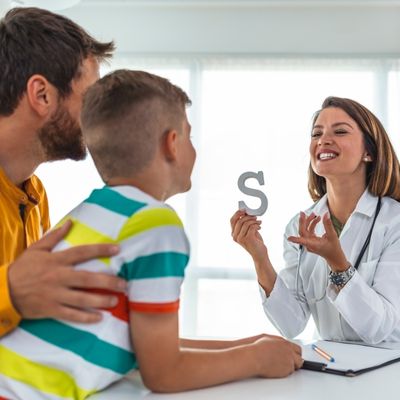 speech therapist working with child